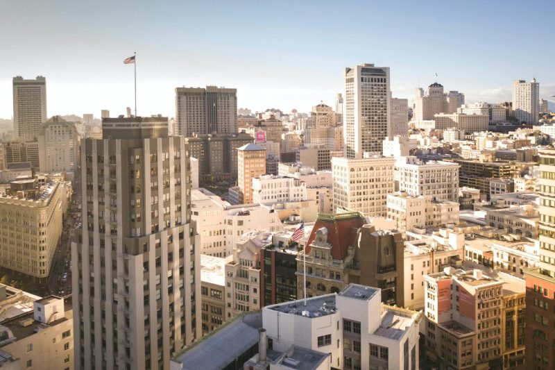Aerial view of San Francisco's downtown skyline featuring iconic skyscrapers on a clear day.