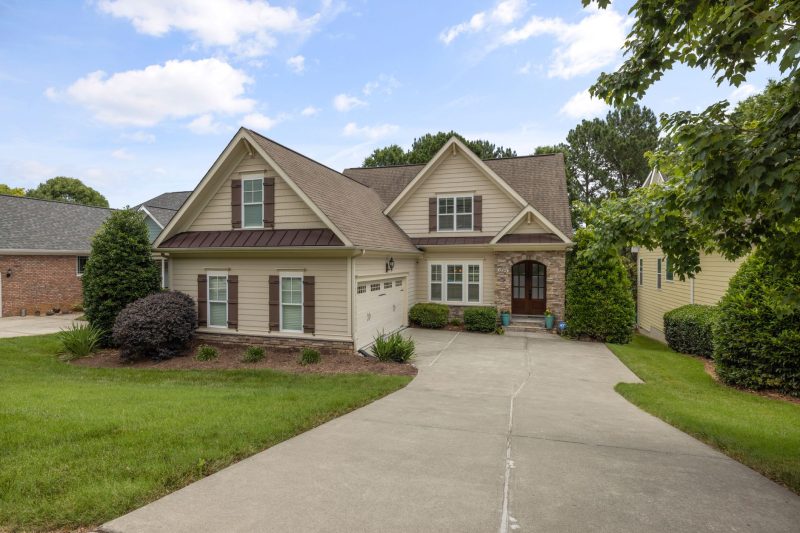 Beautiful suburban family home with a well-maintained lawn and driveway.